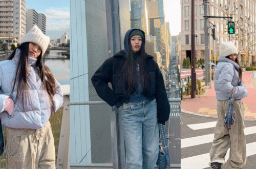 Alo Yoga 冬季穿搭評測：女生穿著寶寶藍羽絨外套 (Gold Rush Puffer)、白色貓耳毛帽搭配卡其色工裝寬褲，展現輕盈顯瘦的冬季旅遊造型。Winter travel outfit: girl wearing Alo Yoga Gold Rush Puffer in Baby Blue, white cat ear beanie, and khaki wide-leg cargo pants.