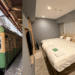 A collage image for a Kipp Hotel Fujisawa review featuring the green Enoden train and a spacious hotel room.