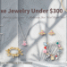 A flat-lay curation of must-have designer jewelry for 2026, featuring silver bow earrings by Marland Bucks, a gold butterfly and heart chain bracelet, a silver Vivienne Westwood Saturn orb necklace with pink crystals, Roxanne Assoulin red heart pendant, Heaven Mayhem interlocking gold earrings, a mixed metal and pearl drop earring, and a complex Marc Jacobs charm bracelet. Background is a light grey marble wall with tropical leaf shadows.