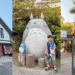 Collage showing the Teddy Bear Factory building, a big Totoro statue in the garden, and the welcome Catbus entrance.